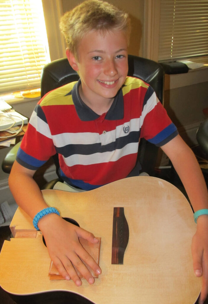 david h. scott working on making a guitar