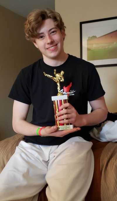 david holding third place trophy - karate tournament