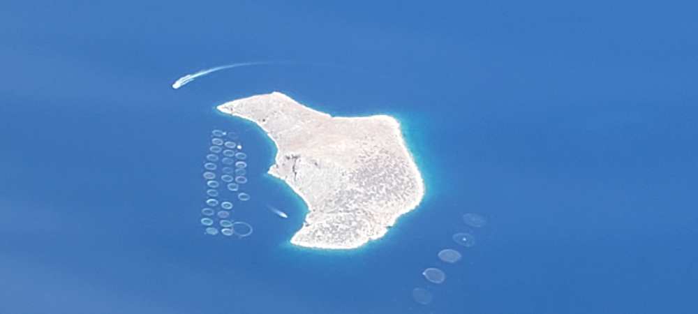 view from airplane of the island of vrachonisis petronisi