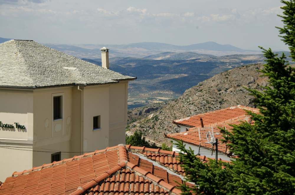 mountain landscape view from behind the lotus tree hotel in portaria, greece