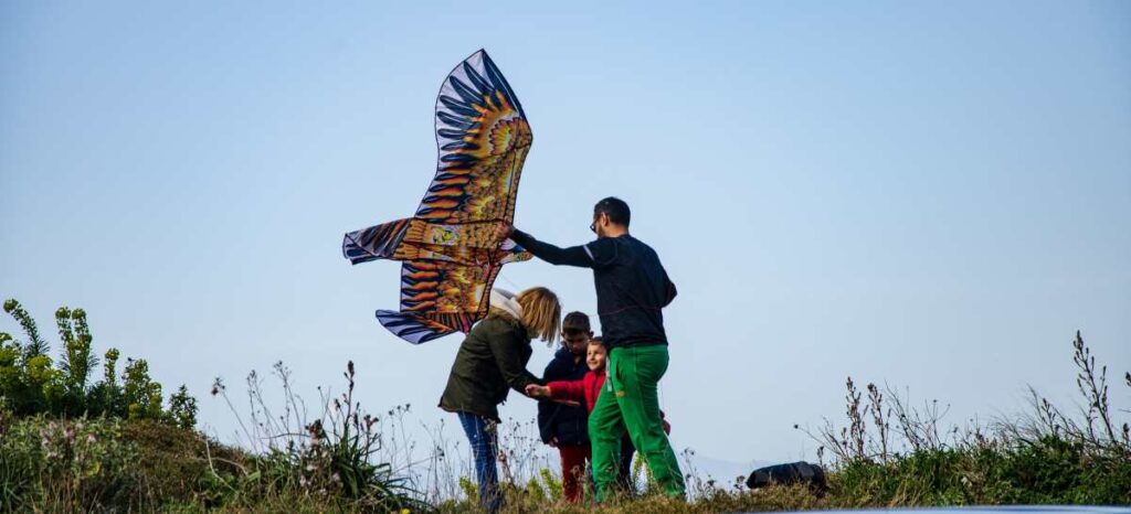 family flying a kite at acrocorinth on clean monday 2020