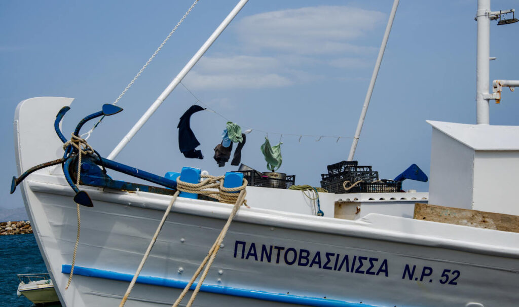 Pantovasilissa fishing vessel with clothes hanging on the bow