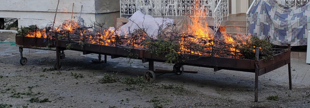 fire growing on barbecue pit